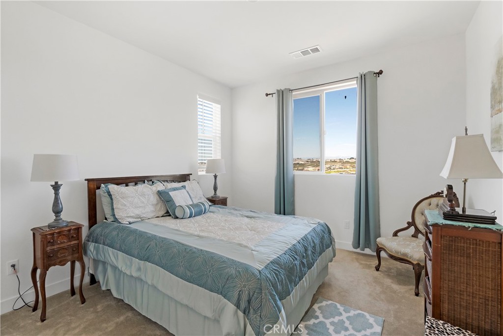 13500 Gold Medal Court Riverside, CA 92503 - Photo 37 of 48 a bedroom with a bed and wooden floor