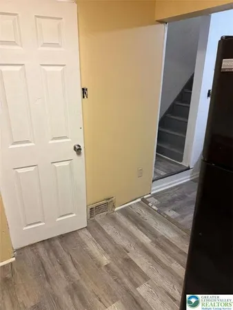 a view of an empty room with stairs