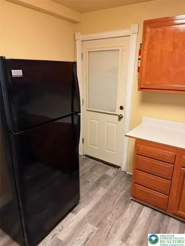a kitchen with a sink and a stove top oven