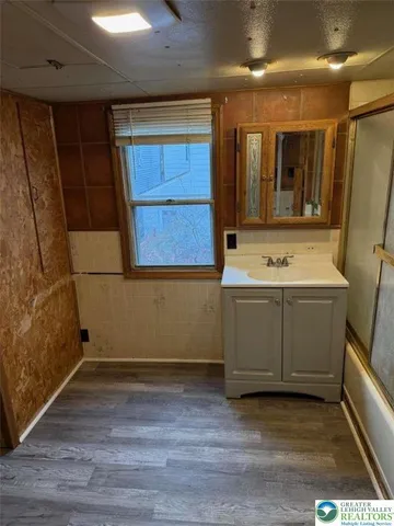 a bathroom with a sink and a mirror