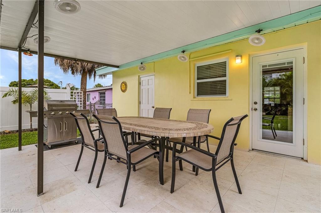 1281 10th Street North Naples, FL 34102 - Photo 7 of 31 View of patio with outdoor dining area