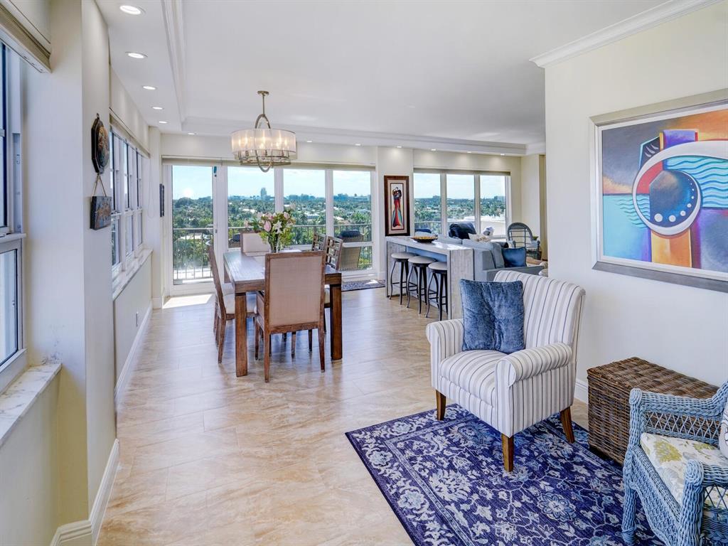 2500 East Las Olas Boulevard, Unit 901 Fort Lauderdale, FL 33301 - Photo 15 of 44 a living room with furniture and a chandelier