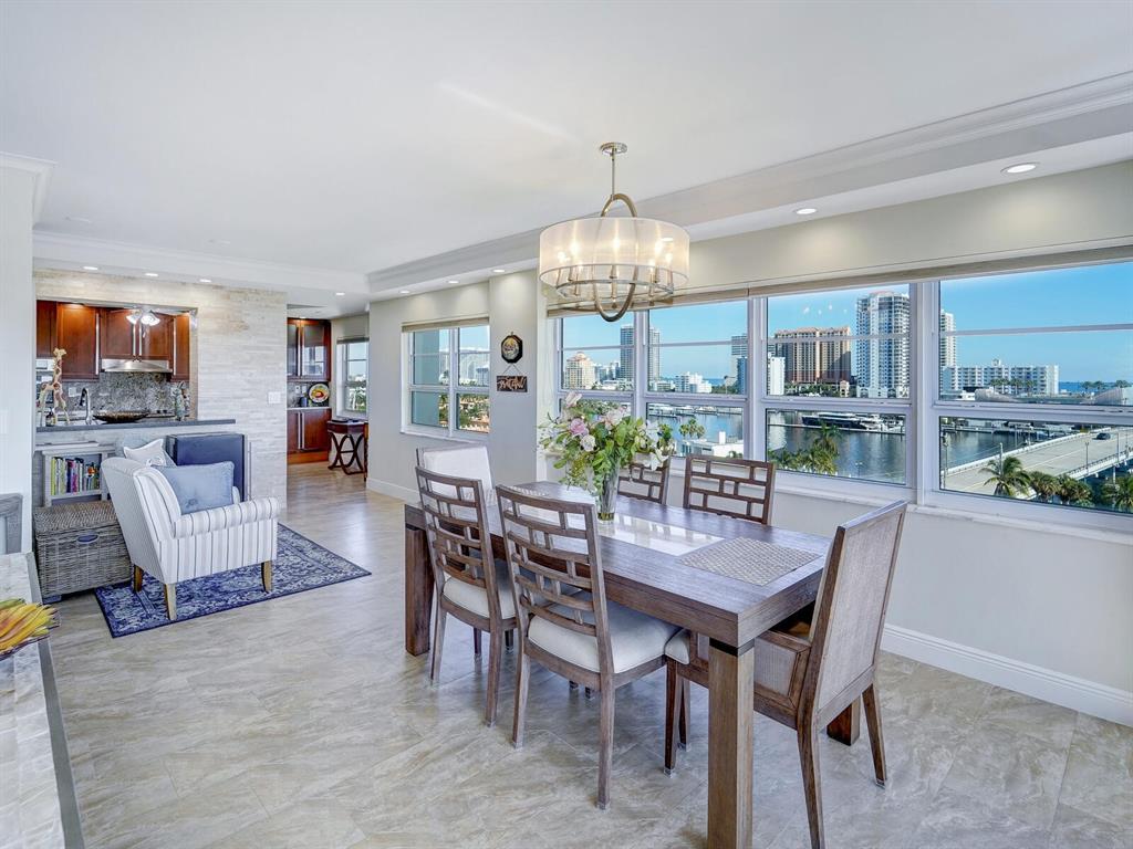 2500 East Las Olas Boulevard, Unit 901 Fort Lauderdale, FL 33301 - Photo 16 of 44 a view of a dining room with furniture window and wooden floor