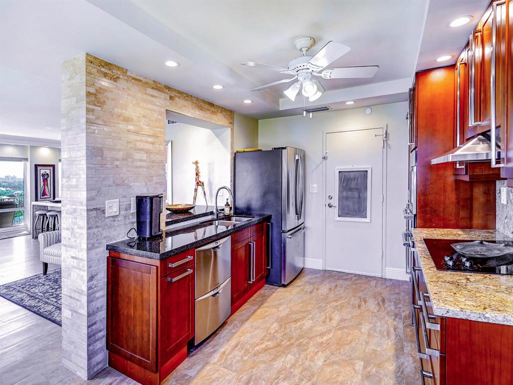 2500 East Las Olas Boulevard, Unit 901 Fort Lauderdale, FL 33301 - Photo 21 of 44 a kitchen with stainless steel appliances granite countertop a stove a sink dishwasher and a refrigerator