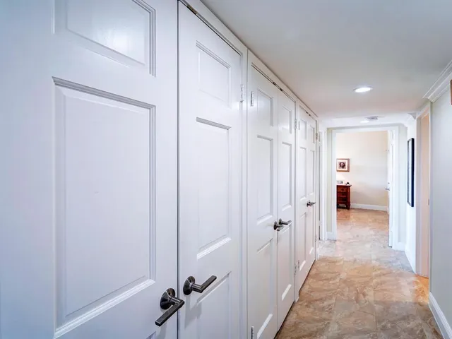 a view of a hallway with closet