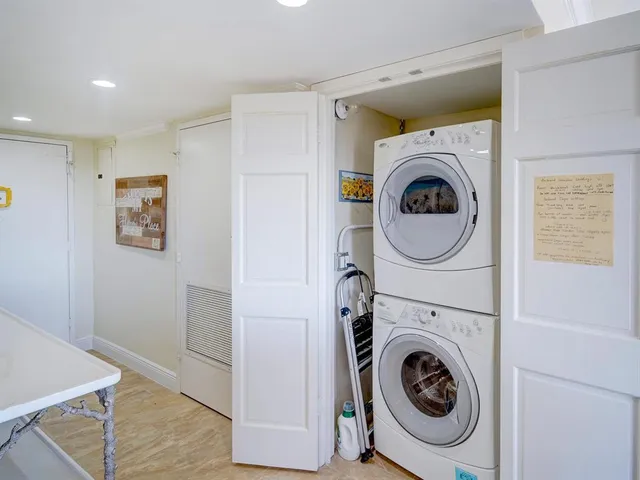 a view of a hallway with washer and dryer