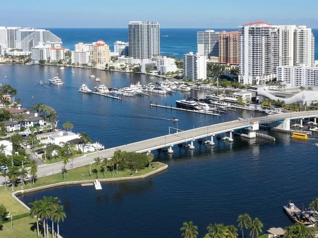 a view of a swimming pool with outdoor seating