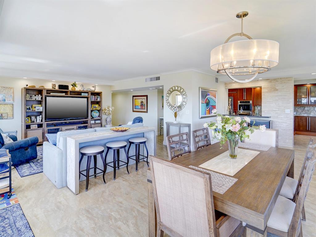 2500 East Las Olas Boulevard, Unit 901 Fort Lauderdale, FL 33301 - Photo 10 of 44 a living room with furniture and a flat screen tv