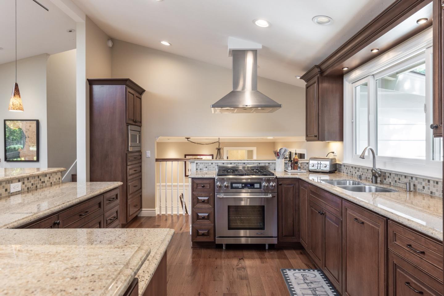 3125 Bird Rock Road Pebble Beach, CA 93953 - Photo 13 of 35 a kitchen with stainless steel appliances granite countertop a sink stove and refrigerator