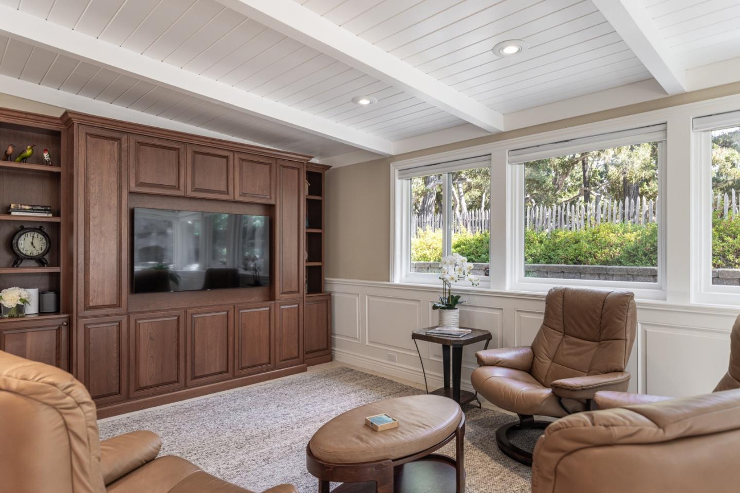 3125 Bird Rock Road Pebble Beach, CA 93953 - Photo 15 of 35 a living room with furniture and a flat screen tv