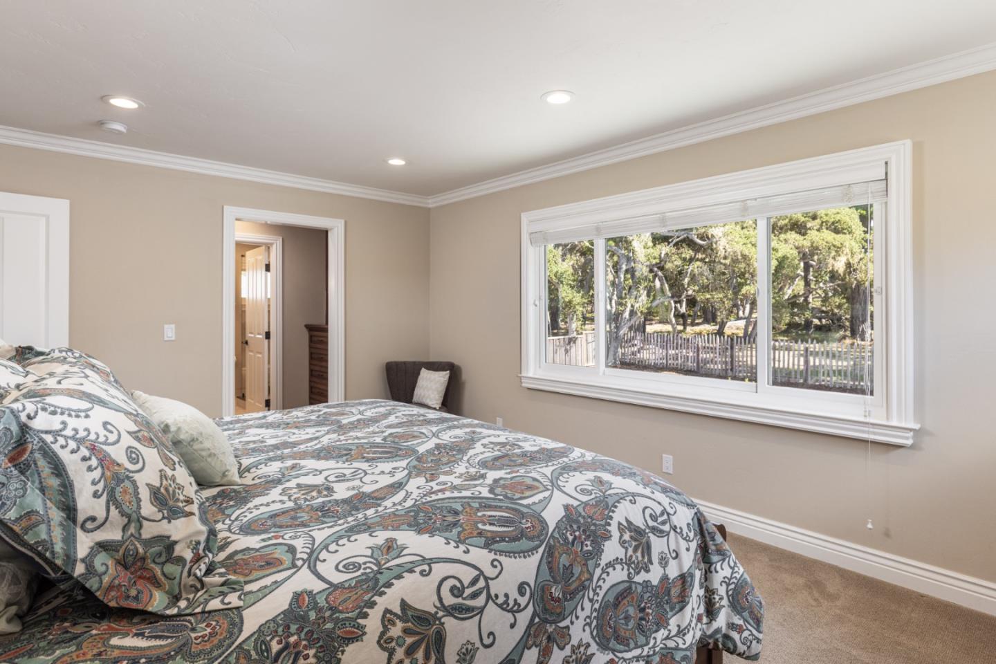 3125 Bird Rock Road Pebble Beach, CA 93953 - Photo 19 of 35 a bedroom with a large bed and a window