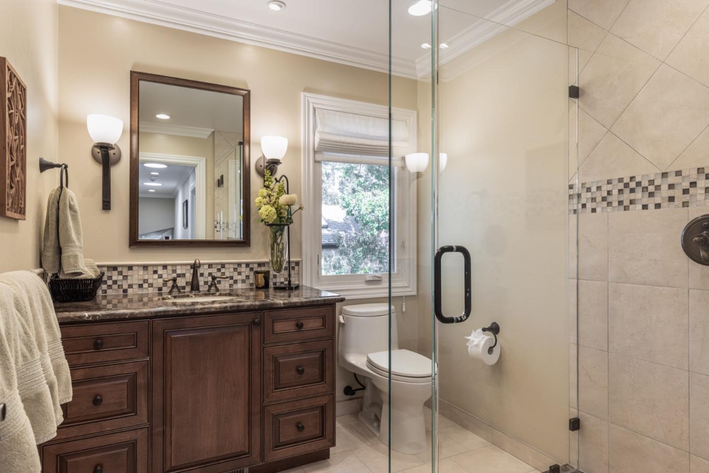 3125 Bird Rock Road Pebble Beach, CA 93953 - Photo 23 of 35 a bathroom with a double vanity sink toilet and shower