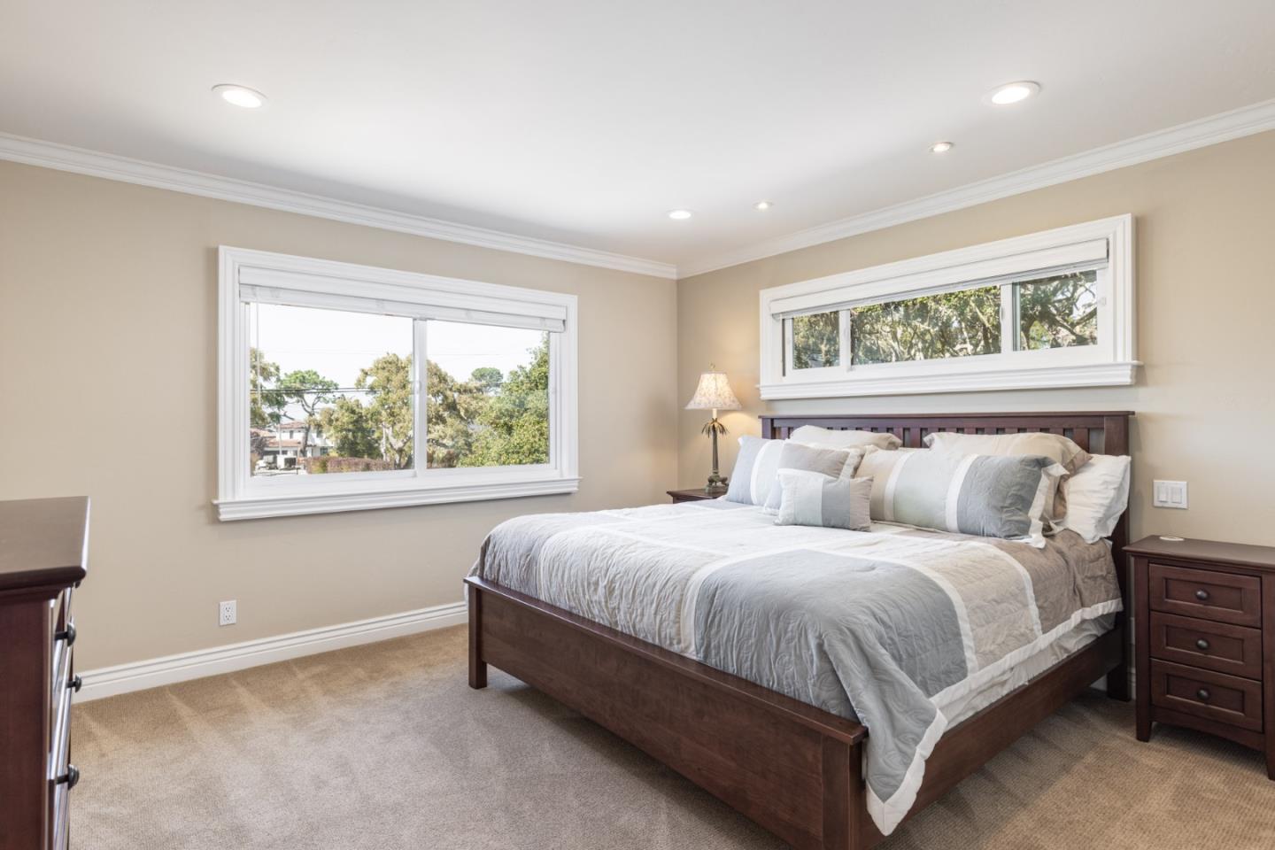 3125 Bird Rock Road Pebble Beach, CA 93953 - Photo 24 of 35 a bedroom with a bed and window