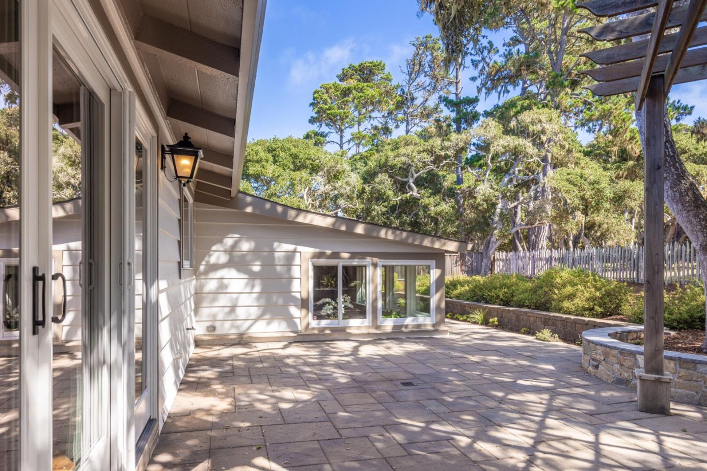 3125 Bird Rock Road Pebble Beach, CA 93953 - Photo 28 of 35 a front view of a house with garden