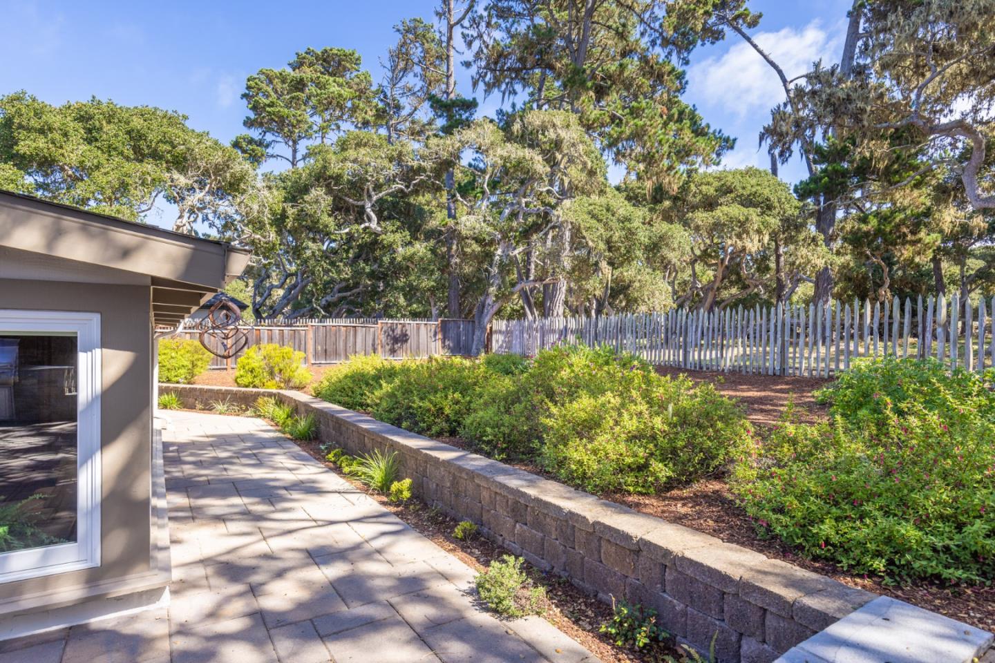 3125 Bird Rock Road Pebble Beach, CA 93953 - Photo 29 of 35 a view of a back yard with flower plants