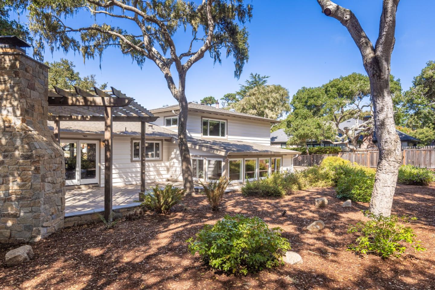 3125 Bird Rock Road Pebble Beach, CA 93953 - Photo 31 of 35 a front view of a house with garden