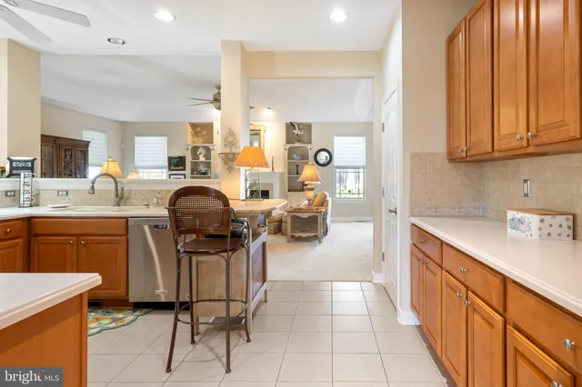 a dining room with furniture and a window
