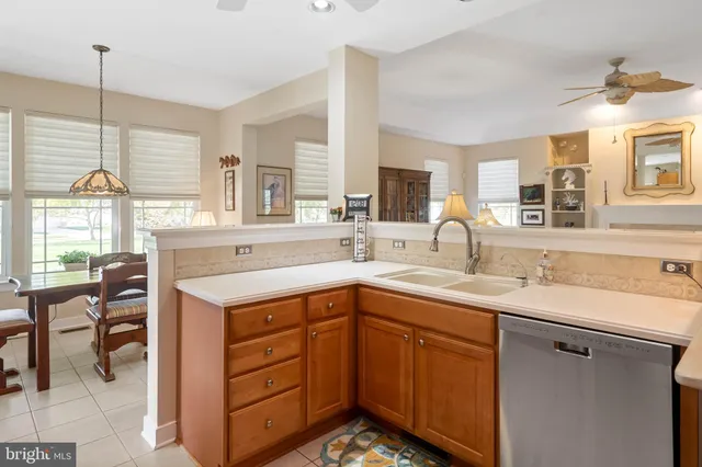 a view of a dining room with furniture and a chandelier
