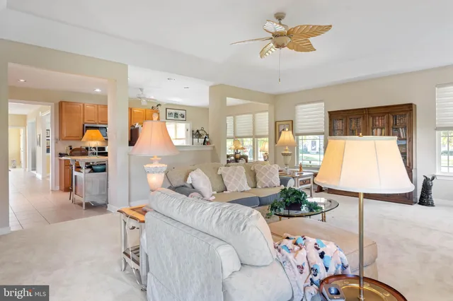 a dining room with wooden floor and a window