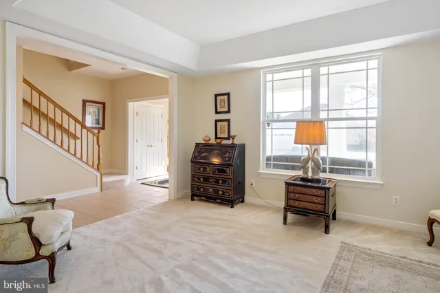 a bathroom with a tub sink and a mirror