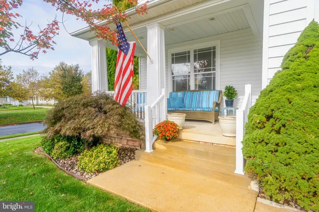 a view of a house with a backyard and a patio