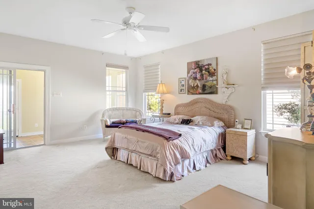 a view of a livingroom with furniture and a flat screen tv