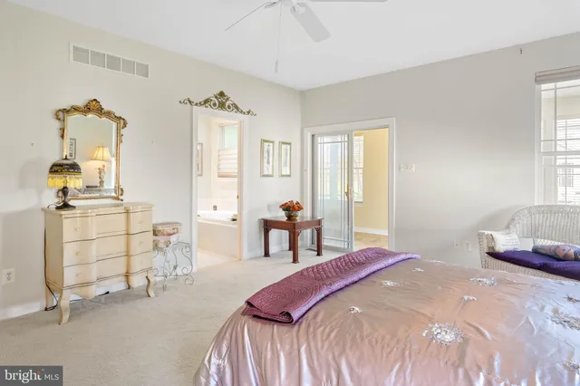 a living room with furniture a clock and a window