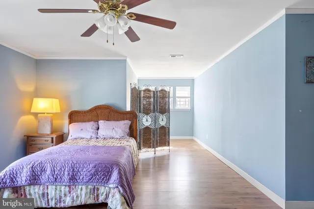an aerial view of multiple houses with a swimming pool