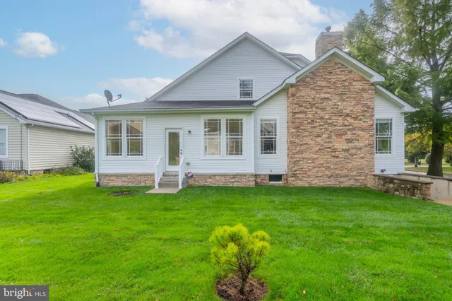 a kitchen with stainless steel appliances granite countertop a stove a refrigerator and a microwave