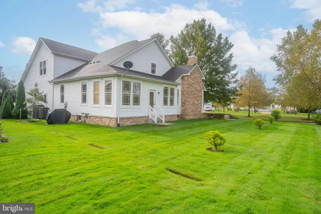 a kitchen with a stove a sink and a microwave