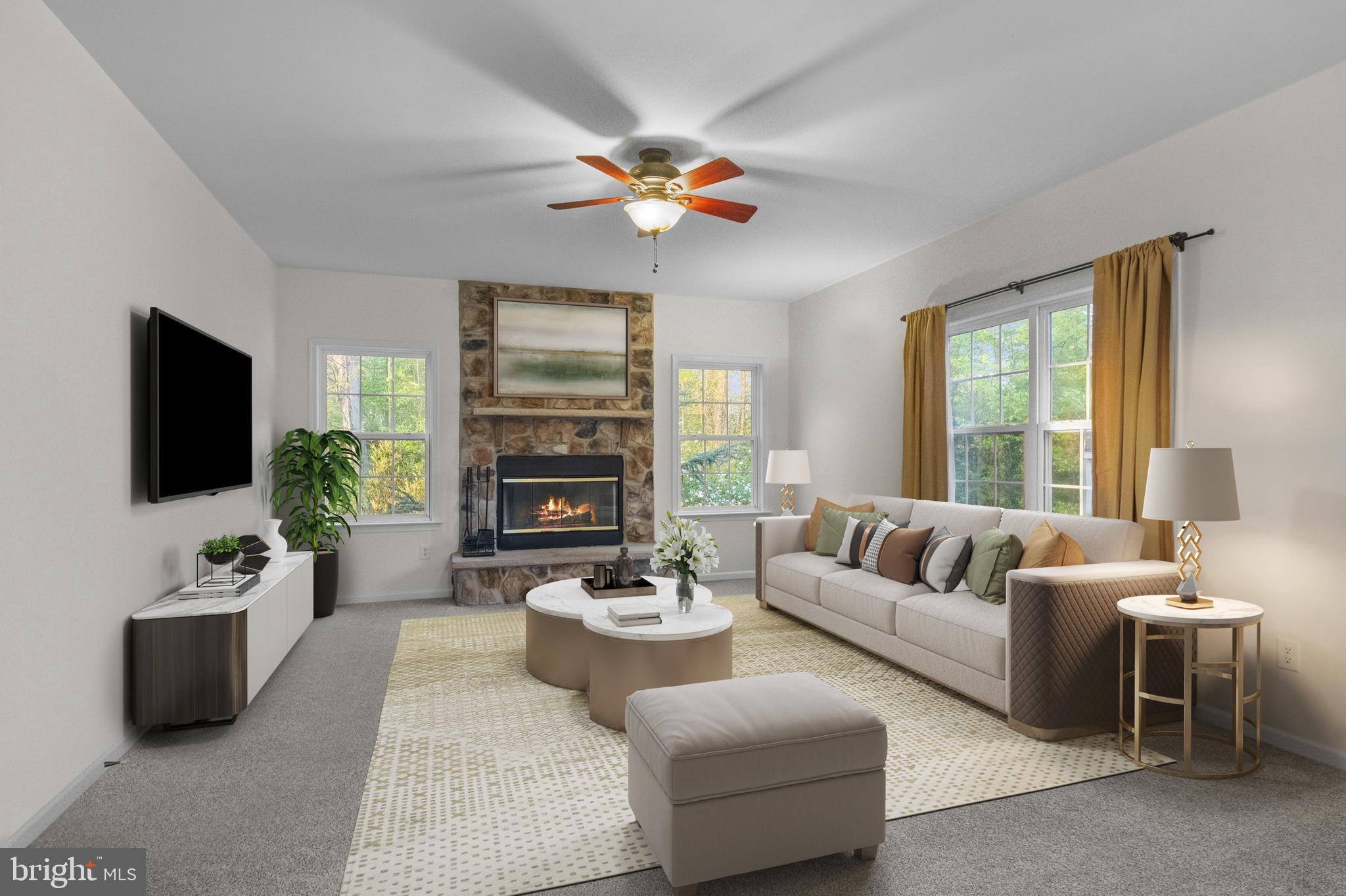 419 Townsend Drive Perkasie, PA 18944 - Photo 11 of 37 a living room with furniture a chandelier and a flat screen tv