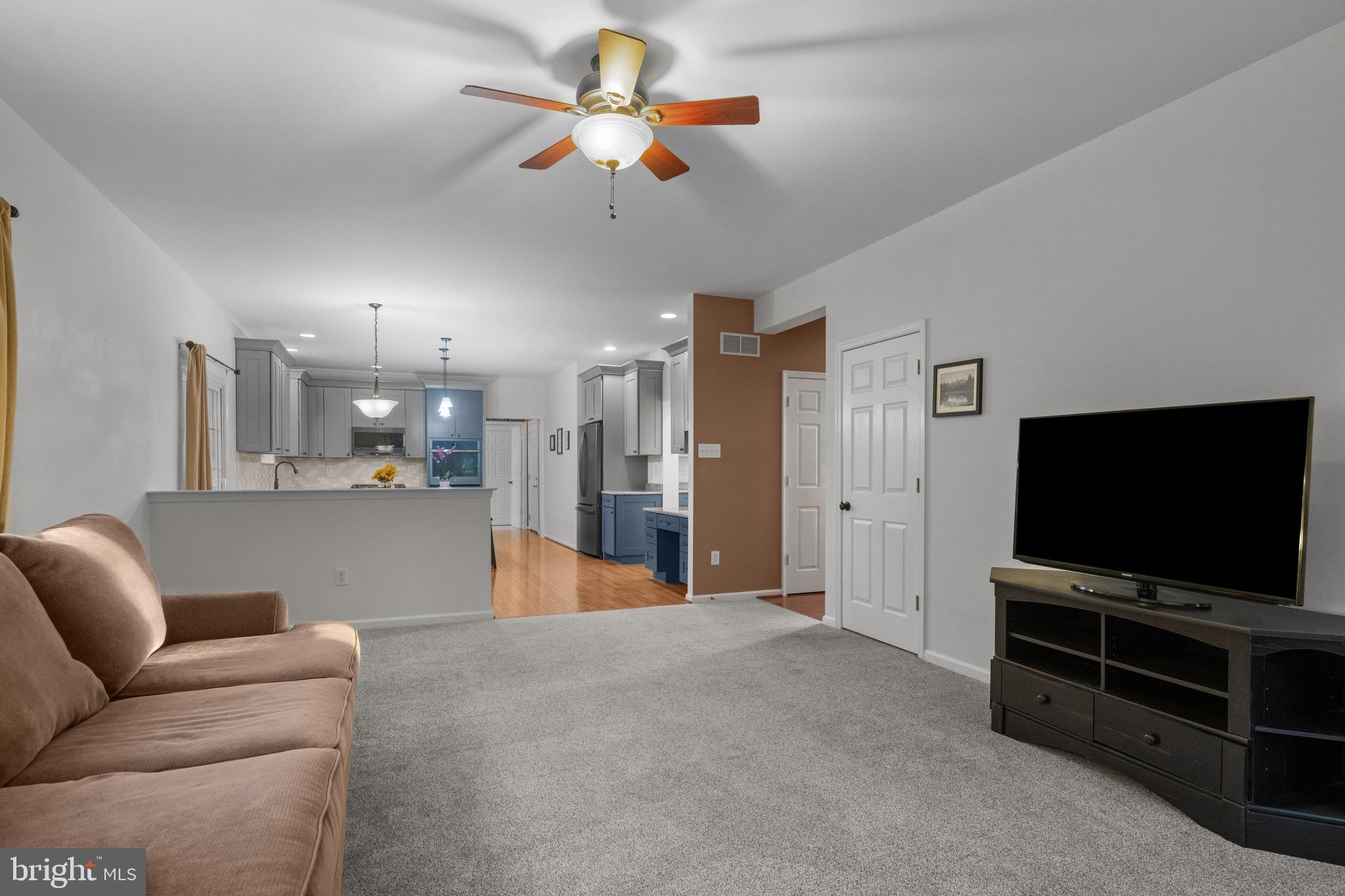 419 Townsend Drive Perkasie, PA 18944 - Photo 13 of 37 a living room with furniture and a flat screen tv