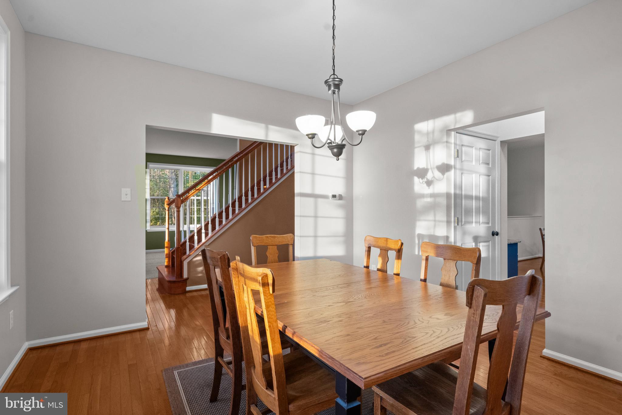 419 Townsend Drive Perkasie, PA 18944 - Photo 14 of 37 a view of a dining room with furniture and wooden floor
