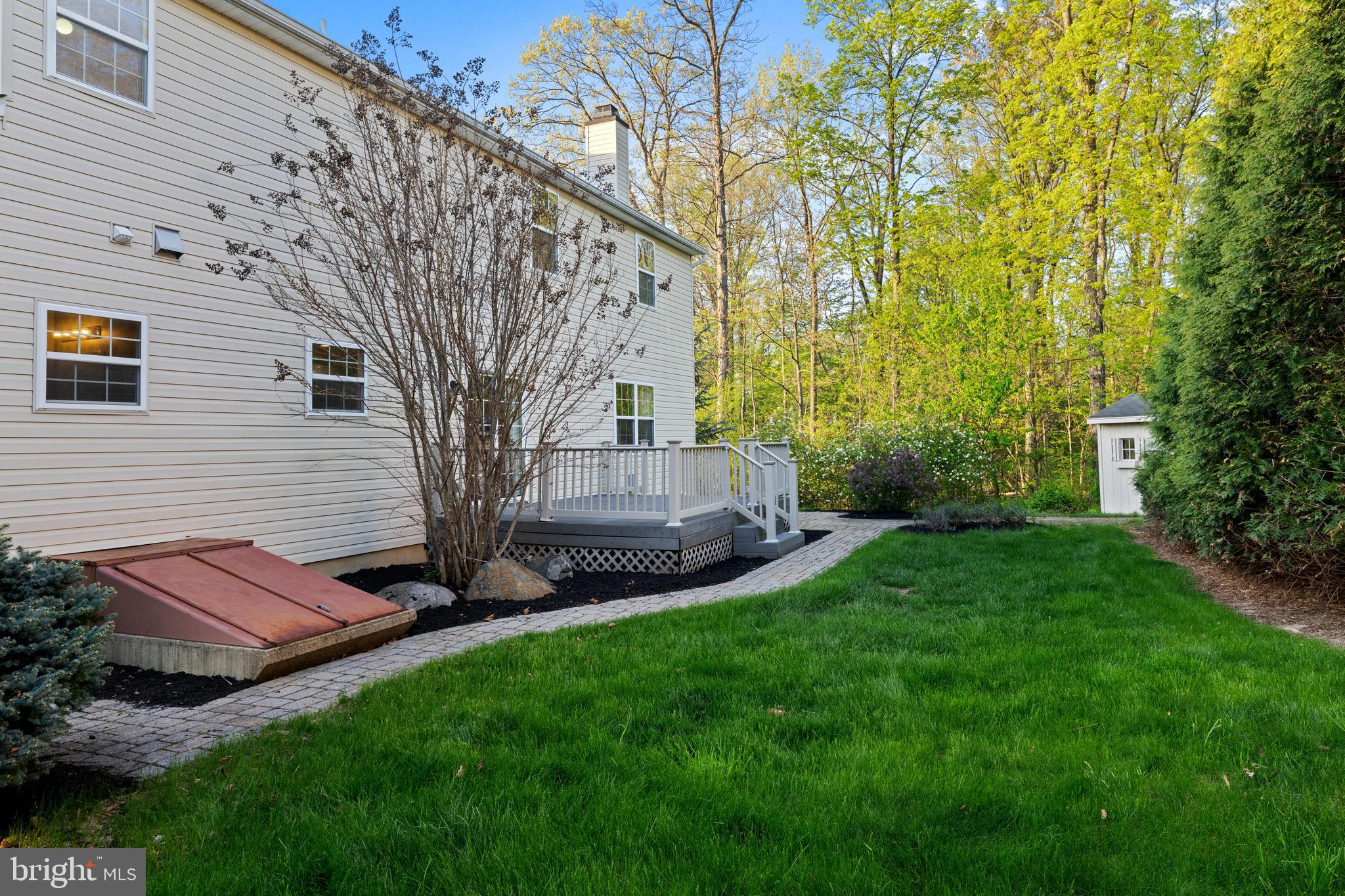419 Townsend Drive Perkasie, PA 18944 - Photo 32 of 37 a view of backyard with plants and garden