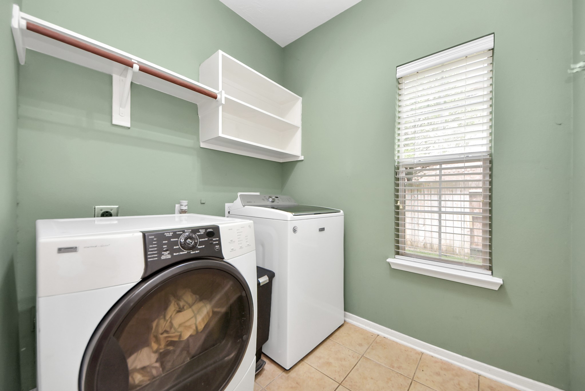 14103 Imperial Wood Lane Rosharon, TX 77583 - Photo 6 of 36 Spacious laundry room with storage shelving