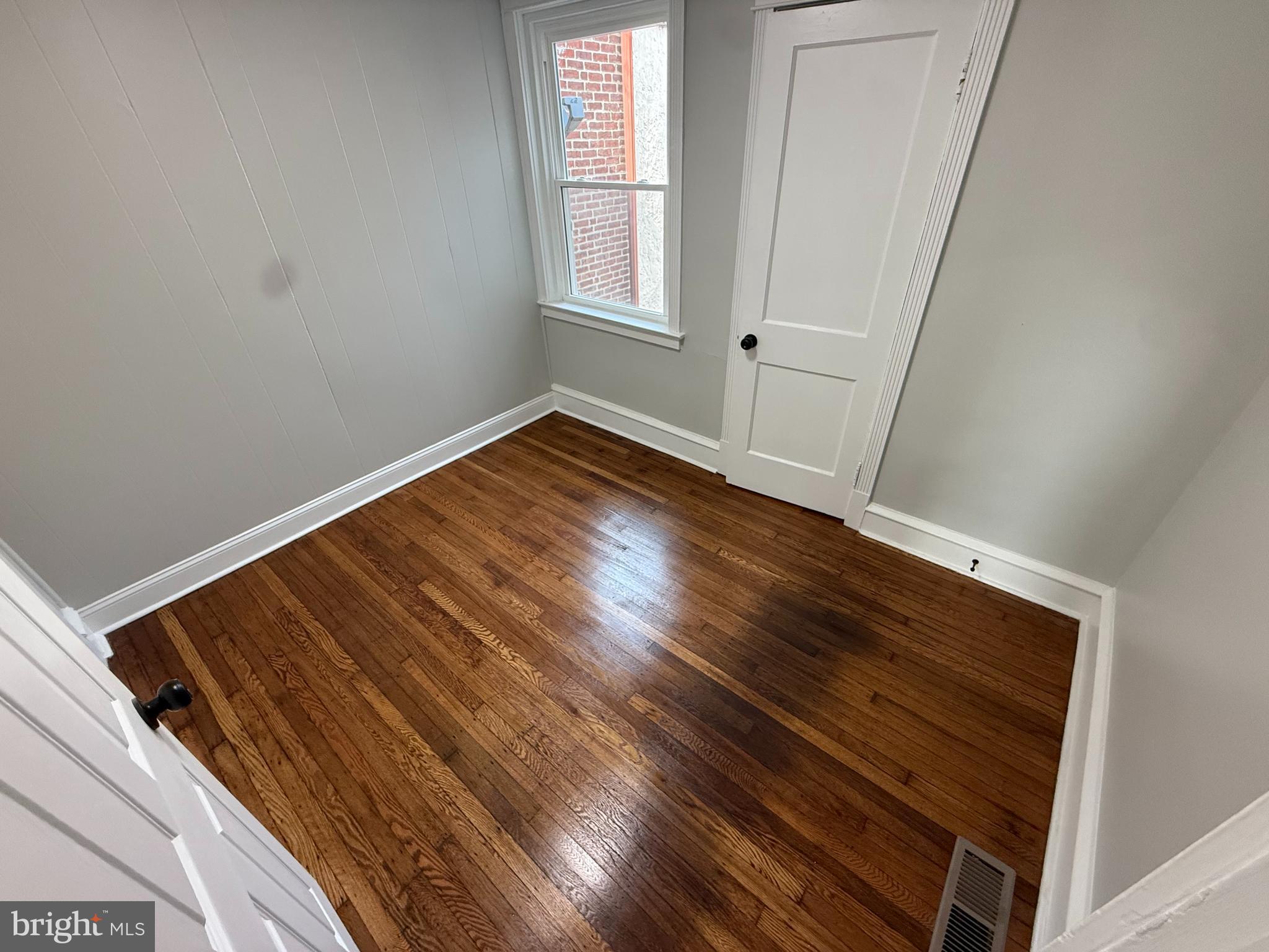 413 Copley Road Upper Darby, PA 19082 - Photo 12 of 21 a view of a room with wooden floor and window