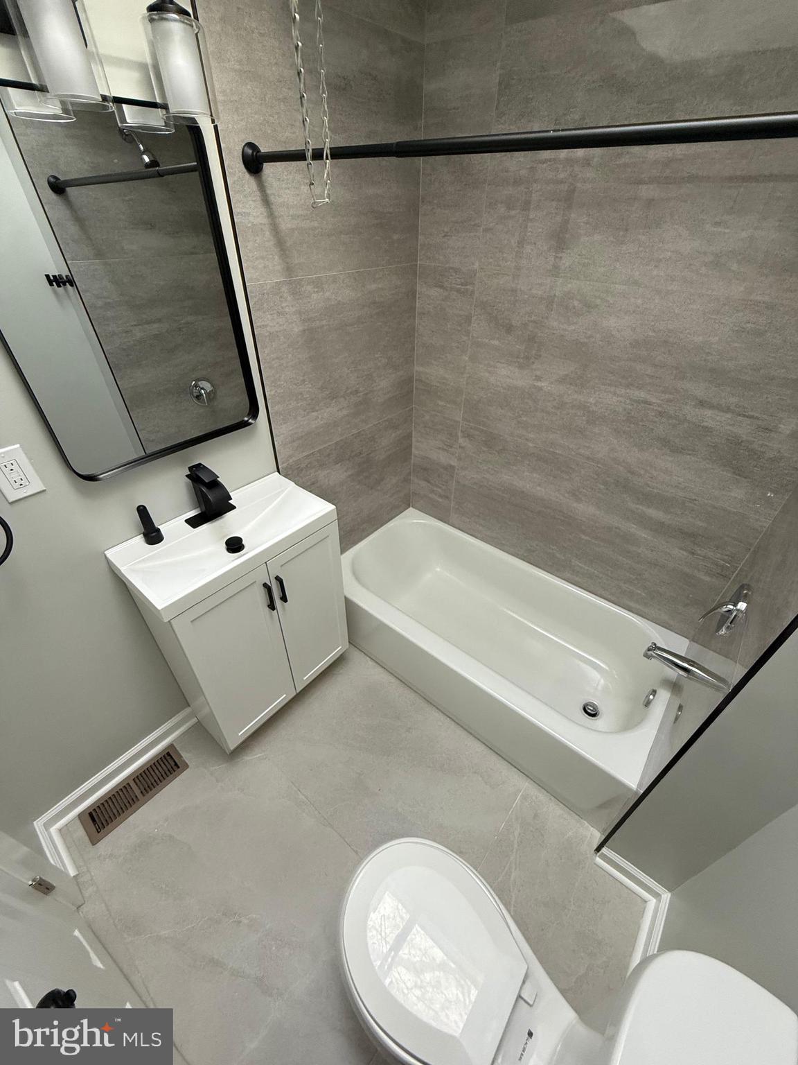 413 Copley Road Upper Darby, PA 19082 - Photo 19 of 21 a bathroom with a sink a toilet and shower