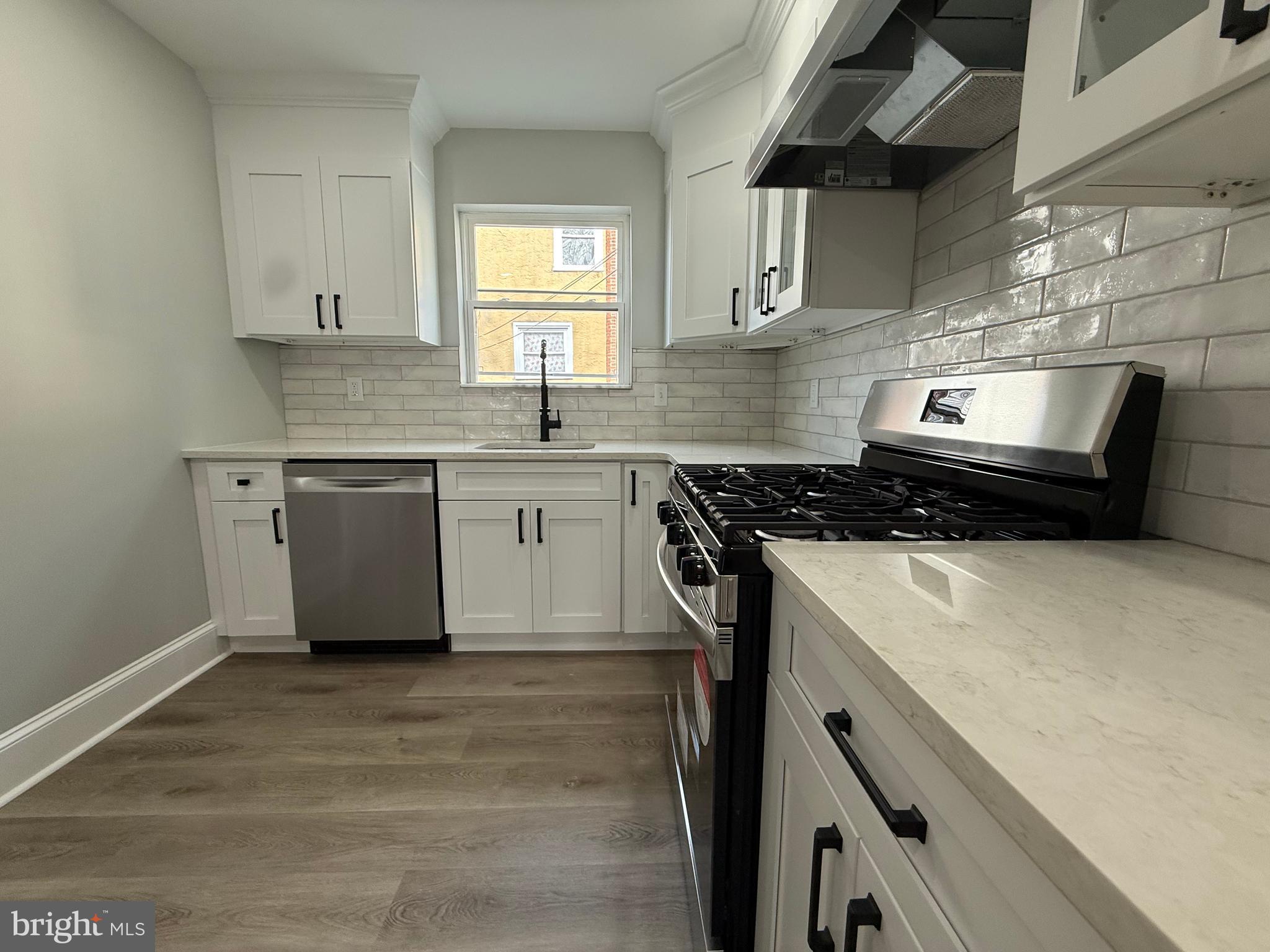 413 Copley Road Upper Darby, PA 19082 - Photo 4 of 21 a kitchen with a stove and a sink