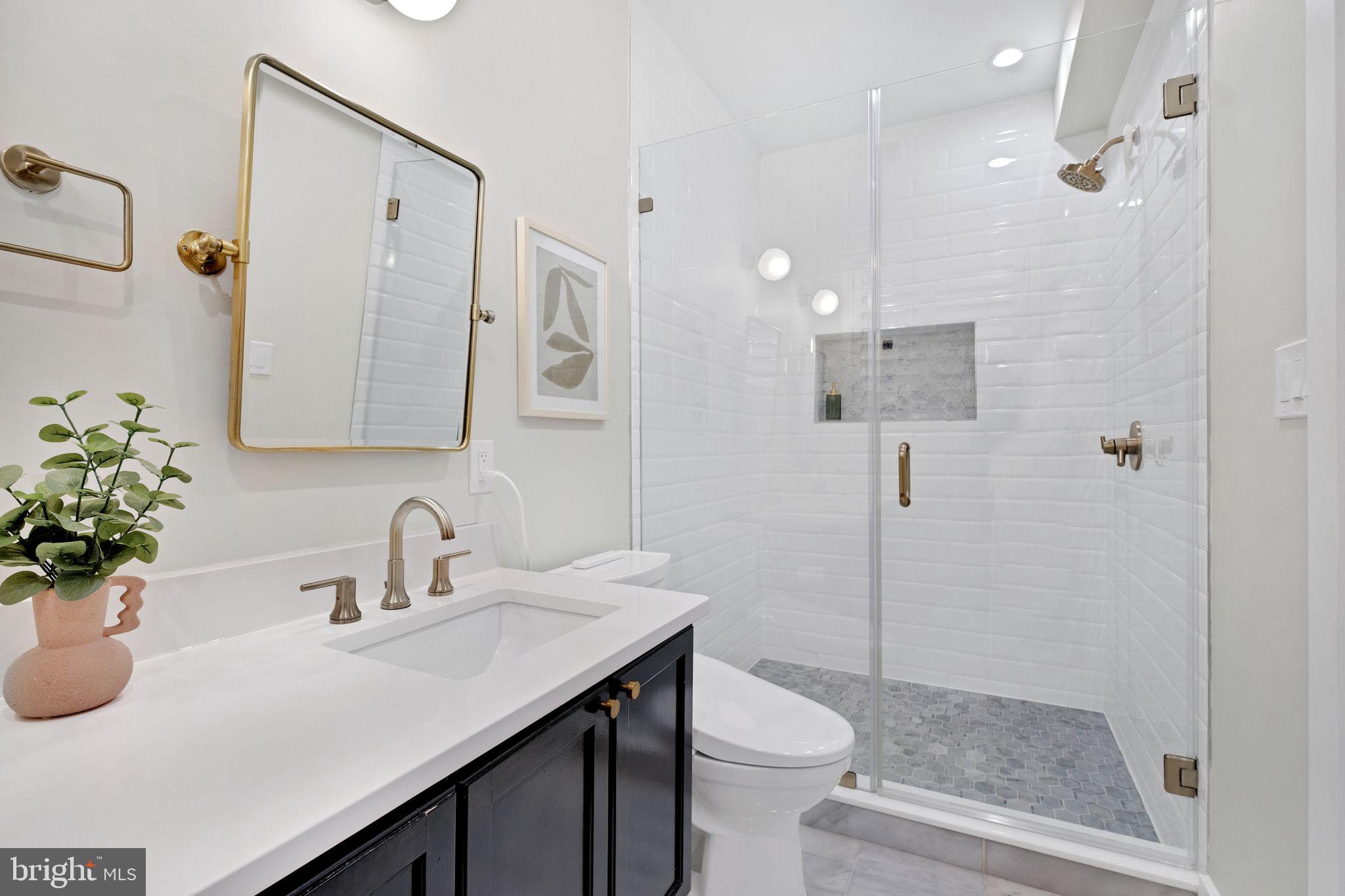 1419 Upshur Street Northwest, Unit 1 Washington, DC 20011 - Photo 16 of 28 a bathroom with a sink toilet and shower