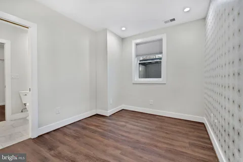 a view of wooden floor in an empty room