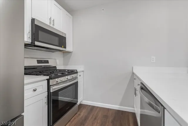 a kitchen with a stove and a microwave