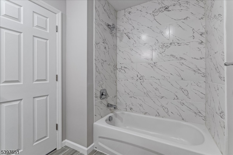 224 Broad Street Bloomfield, NJ 07003 - Photo 15 of 45 a bathroom with bathtub and shower