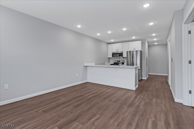 224 Broad Street Bloomfield, NJ 07003 - Photo 17 of 45 a view of a kitchen with a sink and a refrigerator