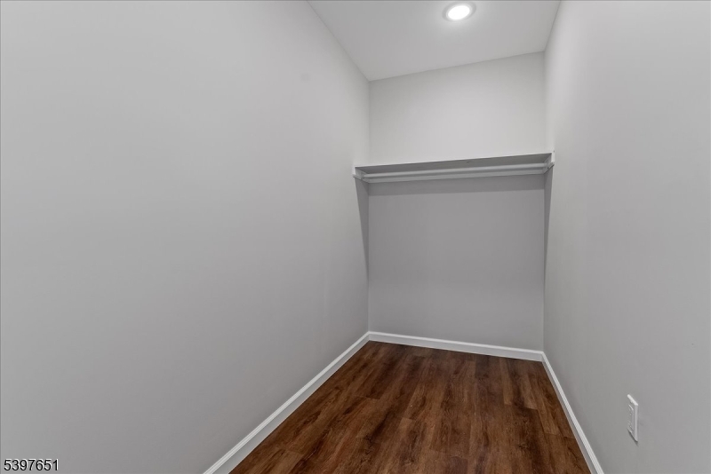 224 Broad Street Bloomfield, NJ 07003 - Photo 21 of 45 a view of a small space with wooden floor and a window