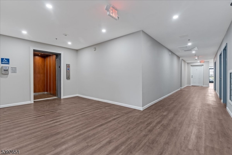 224 Broad Street Bloomfield, NJ 07003 - Photo 24 of 45 a view of an empty room with wooden floor