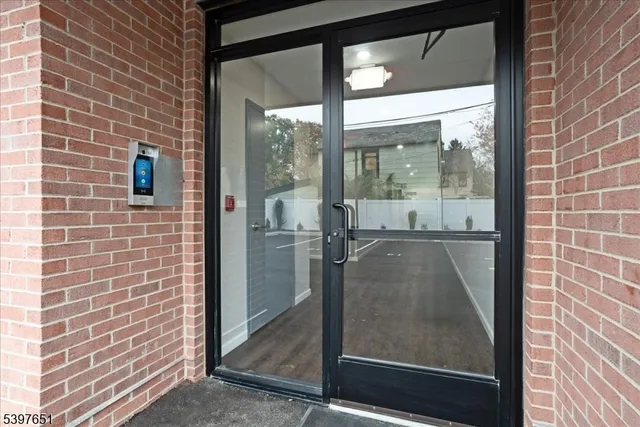 a view of a glass door and a window