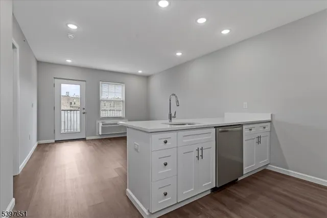 a view of a kitchen with electric appliances