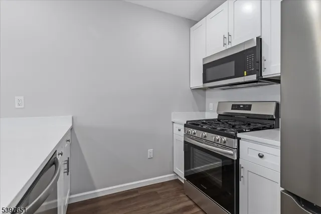 a kitchen with a stove and a microwave