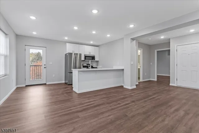 a view of kitchen with cabinets and stainless steel appliances