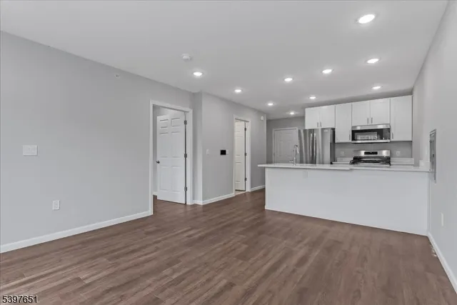 a view of kitchen with wooden floor